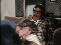 A man with a mustache is given head by a twisted classic milf.